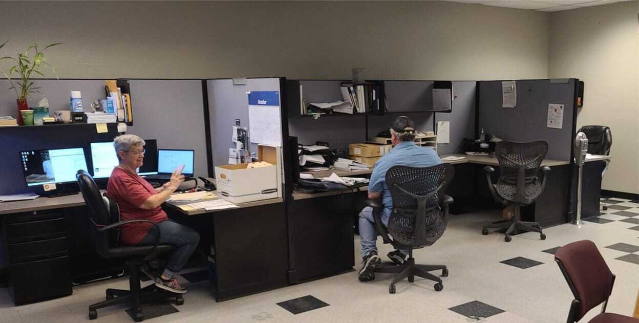 Lyons Roofing office staff working at their desks