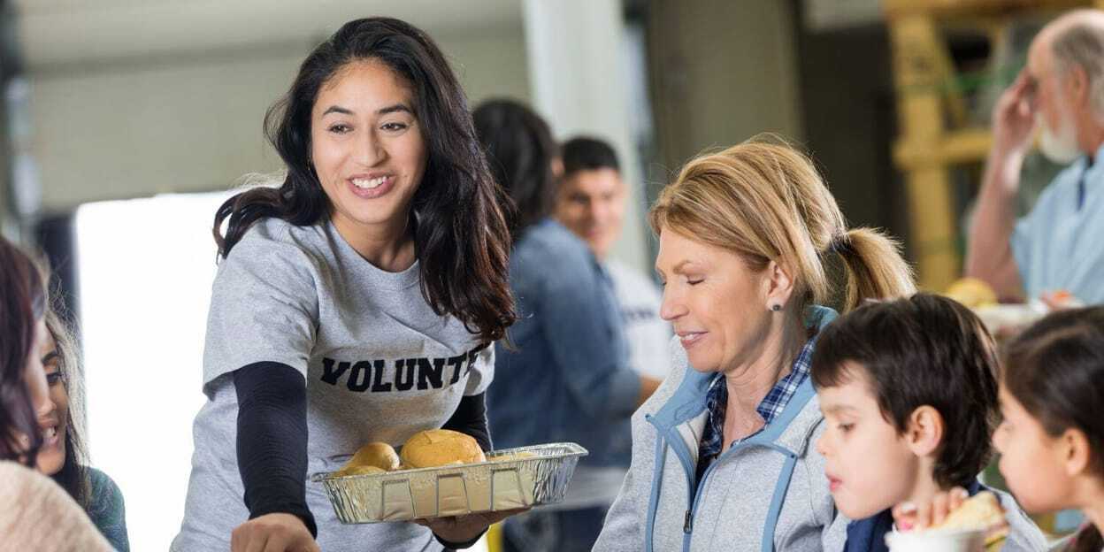Union Station Homeless Services volunteers handing out food