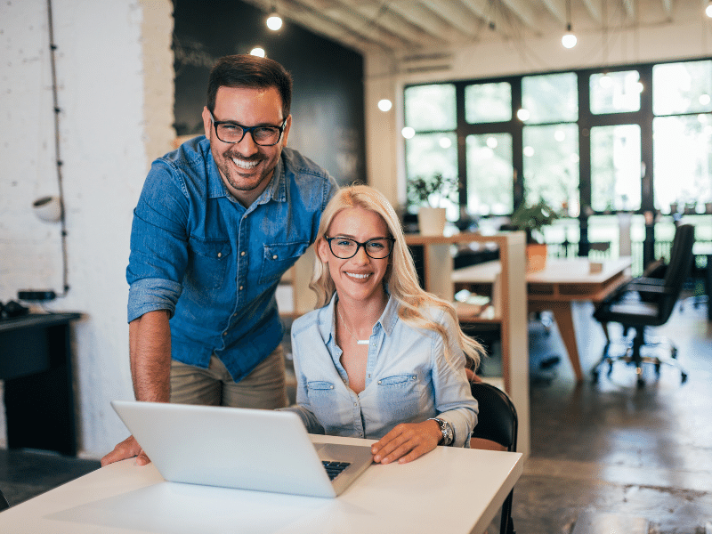 A small organisation team working at a shared desk