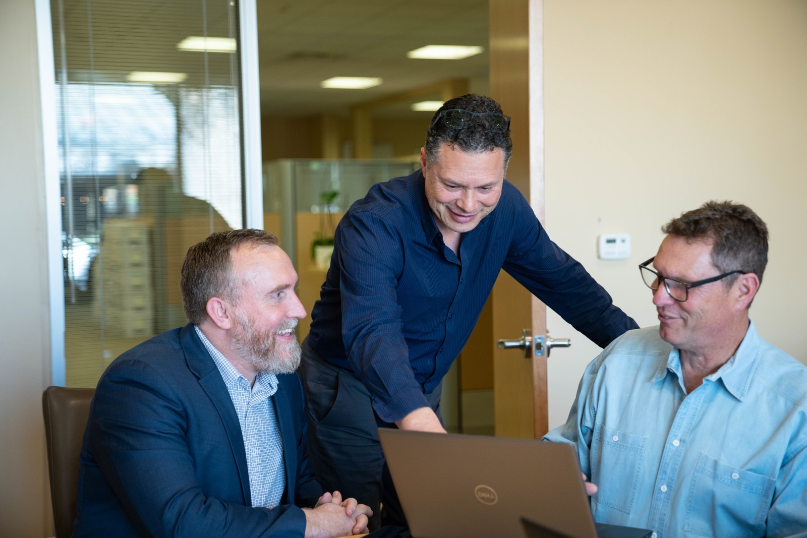 Sean Harris (left), Rob Schenk (middle), and Kraig Kluba (right) discussing what’s next for ITS cybersecurity. 