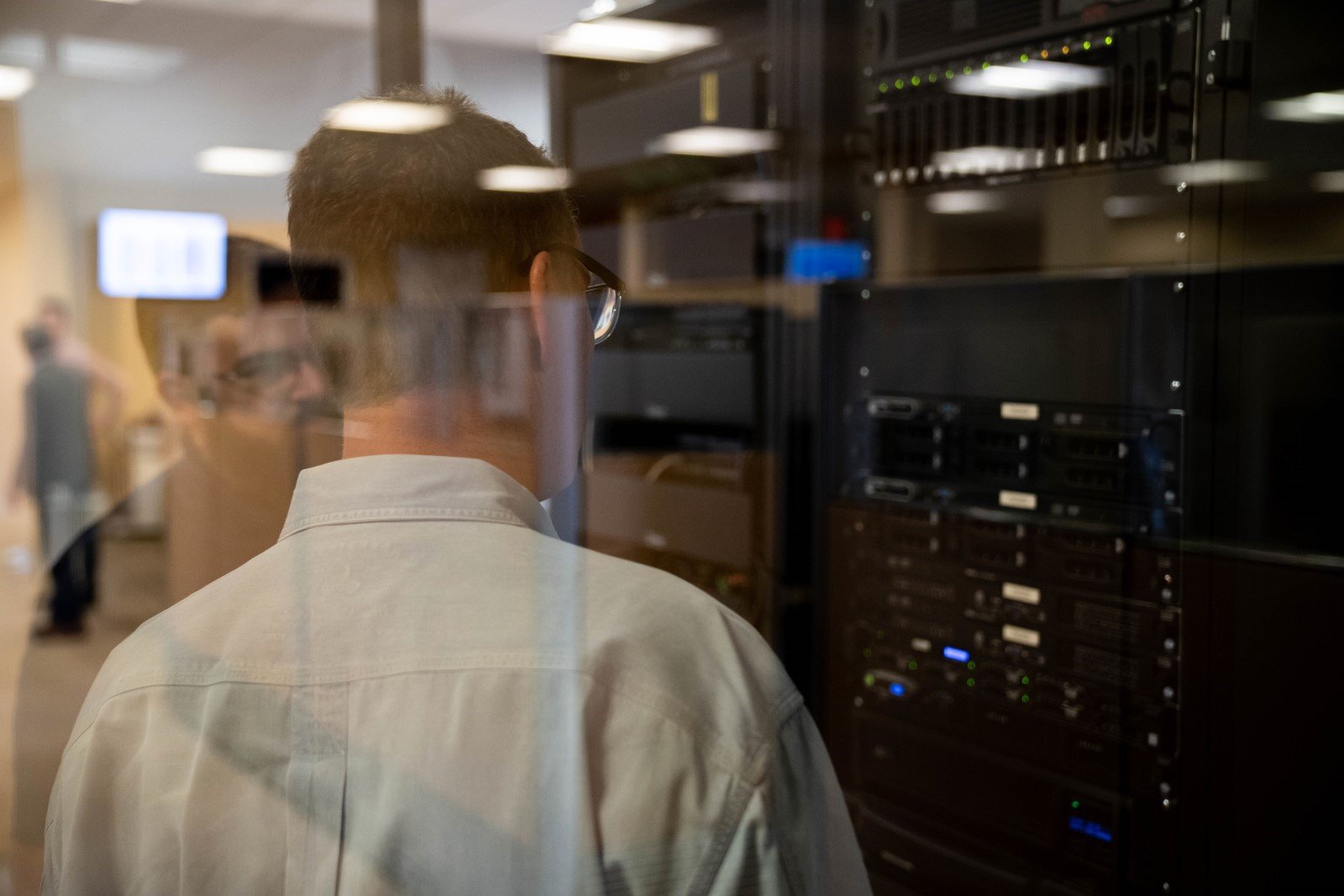 it technicians inspecting a data server